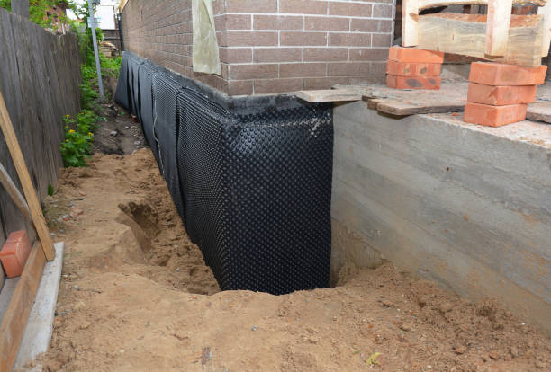 SJ Waterproofing Pros technician performing targeted Basement Waterproofing assessment in Ijamsville, MD